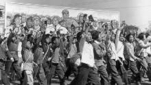 Students waving copies of Chairman Mao Zedong's &quot;Little Red Book&quot; parade in the streets of Beijing in June 1966 at the beginning of the Cultural Revolution. 