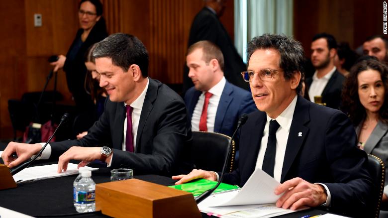 Actor Ben Stiller, front right, and David Miliband, front left, the former British foreign secretary who now leads the International Rescue Committee, sit down to testify before the Senate Foreign Relations Committee on Capitol Hill in Washington, Wednesday, May 1, 2019, during a hearing on the humanitarian Impact of 8 years of war in Syria.