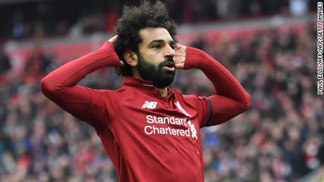 Liverpool&#39;s Egyptian midfielder Mohamed Salah celebrates after scoring their second goal during the English Premier League football match between Liverpool and Chelsea at Anfield in Liverpool, north west England on April 14, 2019. (Photo by Paul ELLIS / AFP) / RESTRICTED TO EDITORIAL USE. No use with unauthorized audio, video, data, fixture lists, club/league logos or &#39;live&#39; services. Online in-match use limited to 120 images. An additional 40 images may be used in extra time. No video emulation. Social media in-match use limited to 120 images. An additional 40 images may be used in extra time. No use in betting publications, games or single club/league/player publications. /         (Photo credit should read PAUL ELLIS/AFP/Getty Images)