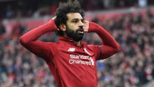 Liverpool&#39;s Egyptian midfielder Mohamed Salah celebrates after scoring their second goal during the English Premier League football match between Liverpool and Chelsea at Anfield in Liverpool, north west England on April 14, 2019. (Photo by Paul ELLIS / AFP) / RESTRICTED TO EDITORIAL USE. No use with unauthorized audio, video, data, fixture lists, club/league logos or &#39;live&#39; services. Online in-match use limited to 120 images. An additional 40 images may be used in extra time. No video emulation. Social media in-match use limited to 120 images. An additional 40 images may be used in extra time. No use in betting publications, games or single club/league/player publications. /         (Photo credit should read PAUL ELLIS/AFP/Getty Images)