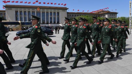 Paramilitary police officers march in Tiananmen Square after a ceremony marking the centennial of the May Fourth Movement on April 30.