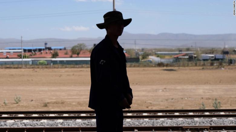 A Chinese railway worker is silhouetted against the Nairobi to Navaisha section of the new Kenyan railway. 