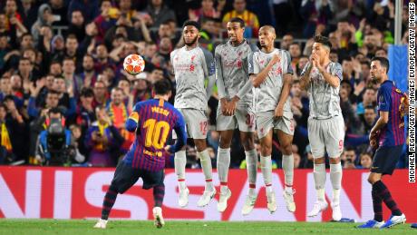Messi scores his second goal in the 3-0 win over Liverpool.