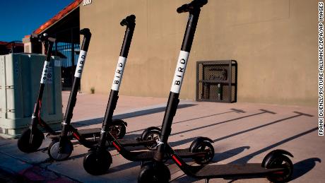 Dockless electric scooters operated by scooter-share company Bird, parked on a sidewalk in San Diego&#39;s North Park, in August 2018. 