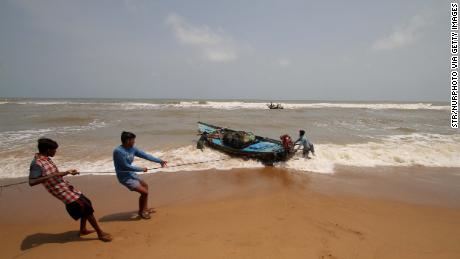 Fishing boats at Konark beach prepare for cyclone Fani in Odisha. 