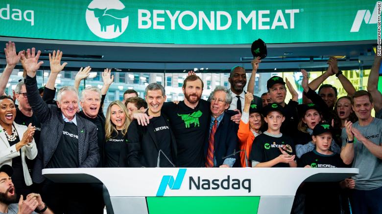 Beyond Meat CEO Ethan Brown, center, celebrates with guests after ringing the opening bell at Nasdaq MarketSite, May 2, 2019 in New York City.