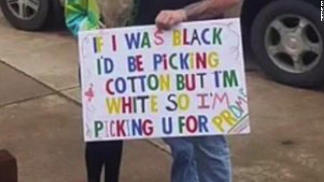 Student held racist promposal sign. Now he's banned from the prom