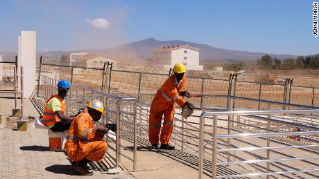 Kenyan workers complete work to a station on the Standard Gauge Railway line.