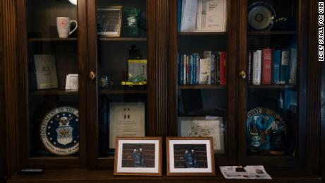 Photos of Miller with Sen. Mitch McConnell sit on the bookshelf in her office.