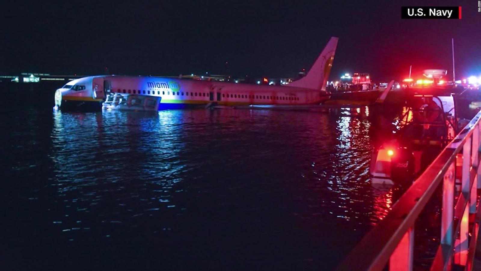 Plane skids off runway into river - CNN Video