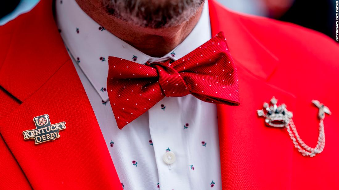 A man wears a rose themed shirt and jacket combo prior to the Kentucky Derby.