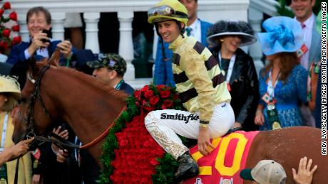 LOUISVILLE, KENTUCKY - MAY 04: Jockey Flavien Prat celebrates atop of Country House #20 after winning the 145th running of the Kentucky Derby at Churchill Downs on May 04, 2019 in Louisville, Kentucky. (Photo by Andy Lyons/Getty Images)
