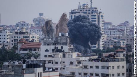 Smoke is sen rising after an Israeli air raid on homes in Gaza City.