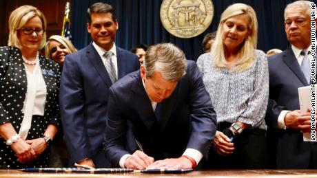 Georgia&#39;s governor signs a controversial abortion bill into law