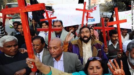 Members of the Pakistan Christian Democratic alliance march during a protest in Lahore on December 25, 2010, in support of Asia Bibi.