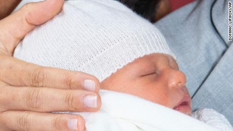 Britain&#39;s Prince Harry and Meghan, Duchess of Sussex, during a photocall with their newborn son, in St. George&#39;s Hall at Windsor Castle.