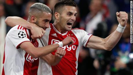 Hakim Ziyech (L) celebrates with teammate Dusan Tadic after scoring Ajax&#39;s second.