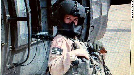 Harmony Allen with a Black Hawk helicopter during her Army training in 1999 at Fort Benning in GA. Allen served in the Army before joining the Air Force in 2000. 