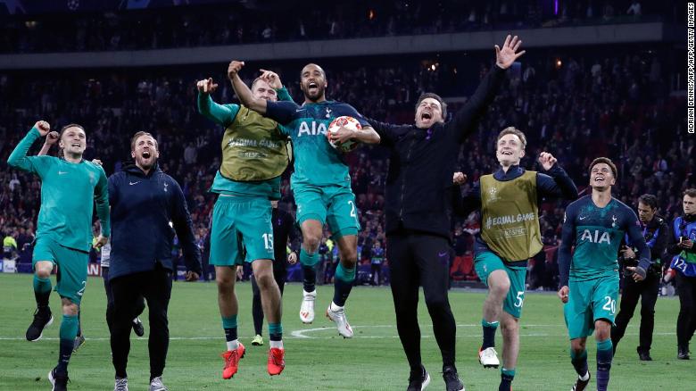 Tottenham's Brazilian forward Lucas Moura celebrates with teammates at the end of the UEFA Champions League semifinal second leg match.