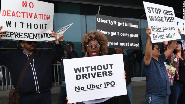 Rideshare drivers for Uber and Lyft stage a strike and protest at the LAX International Airport, over what they say are unfair wages in Los Angeles, California on May 8, 2019. 