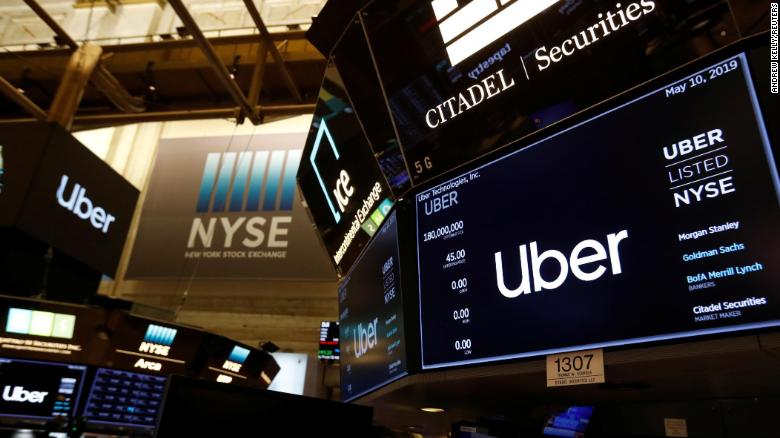 Screens display the Uber Technologies Inc. logo on the floor of the New York Stock Exchange (NYSE) during the company's IPO in New York, U.S., May 10, 2019. REUTERS/Andrew Kelly