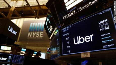 Screens display the Uber Technologies Inc. logo on the floor of the New York Stock Exchange (NYSE) during the company&#39;s IPO in New York, U.S., May 10, 2019. REUTERS/Andrew Kelly