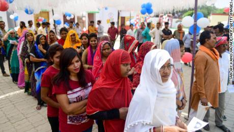 Indian voters queue at a polling station to cast their vote in Allahabad in Uttar Pradesh state on May 12, 2019, for the sixth phase of India&#39;s general election. 