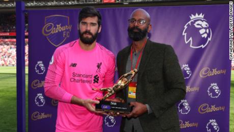 Alisson was handed the Premier League&#39;s Golden Glove trophy after the final game of the season.