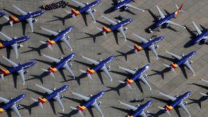 VICTORVILLE, CA - MARCH 27:  A number of Southwest Airlines Boeing 737 MAX aircraft are parked at Southern California Logistics Airport on March 27, 2019 in Victorville, California. Southwest Airlines is waiting out a global grounding of MAX 8 and MAX 9 aircraft at the airport.  (Photo by Mario Tama/Getty Images) 