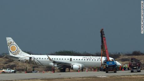 A general view shows a Myanmar National Airlines passenger plane after an emergency landing at Mandalay international airport on May 12, 2019. 