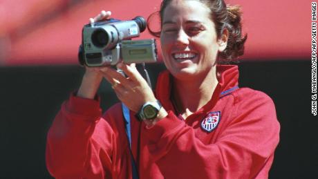 Foudy films her teammates at Stanford Stadium. 