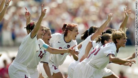 PASADENA, CA - JULY 10:  Joy Fawcett #14 Kate Sobrero #20 and Tisha  Venturini #15 of Team USA celebrate their victory in the Women&#39;s World Cup at The Rose Bowl on July 10, 1999 in Pasadena, California. (Photo by Elsa/Getty Images)