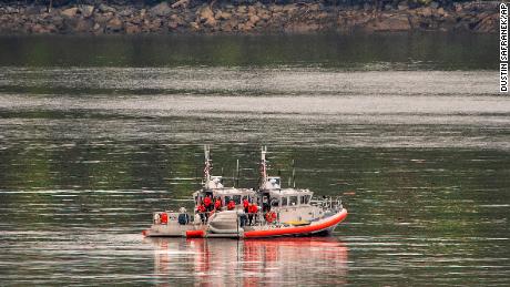 Two U.S. Coast Guard 45-foot response boats drift through George Inlet as part of a search effort on Tuesday near Ketchikan, Alaska.