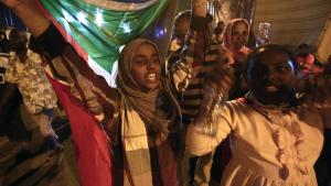 TOPSHOT - Sudanese protestors celebrate after an agreement was reached with the military council to form a three-year transition period for transferring power to a full civilian administration, in Khartoum, early on May 15, 2019. - The protest movement is demanding a civilian-led transition following 30 years of iron-fisted rule by now deposed president Omar al-Bashir, but the generals who toppled him have been holding onto a leadership role. (Photo by ASHRAF SHAZLY / AFP)        (Photo credit should read ASHRAF SHAZLY/AFP/Getty Images)