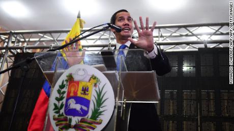 Venezuelan opposition leader and self-declared president Juan Guaido talks at a meeting in Caraca&#39;s Chamber of Commerce Auditorium.