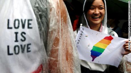 Supporters of same-sex marriage gather outside the parliament building as a bill for marriage equality is debated by parliamentarians in Taipei, Taiwan on May 17.