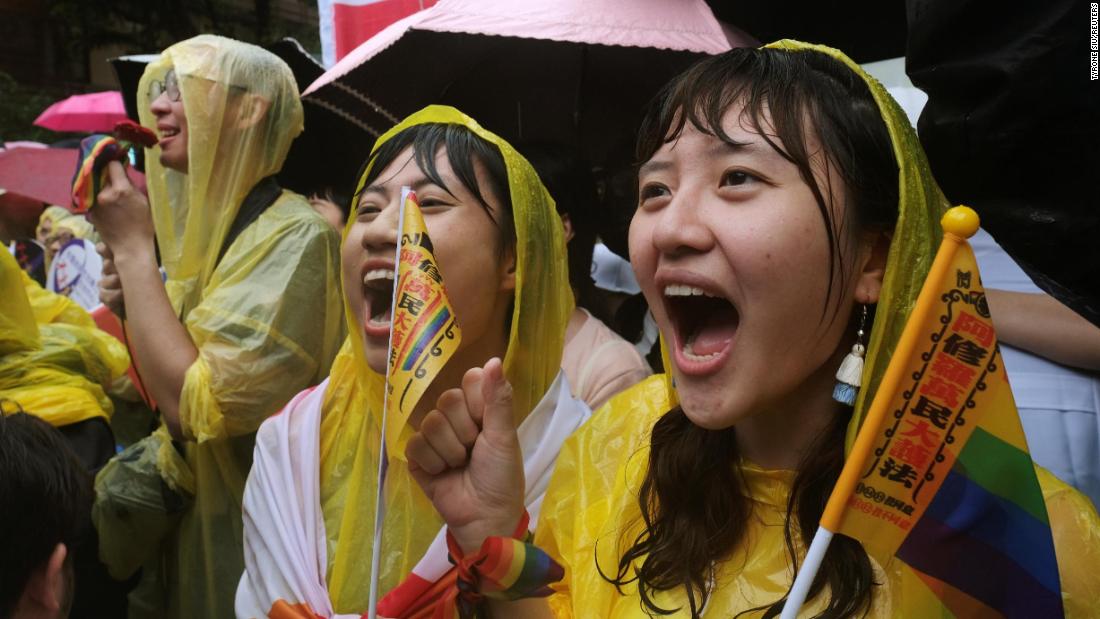 Same-sex marriage supporters shout during a parliament vote on three draft bills of a same-sex marriage law, outside the Legislative Yuan in Taipei, on Friday.