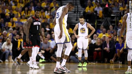 Durant walks off the court after straining his right calf in the game against the Houston Rockets.