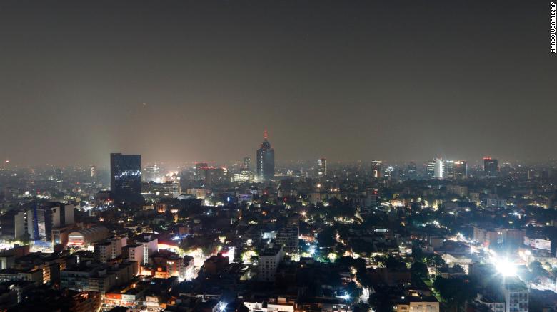 Smoke and pollution hangs over in Mexico City, early Thursday, May 16, 2019. 