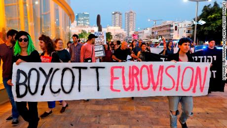 Israelis hold slogans during a protest against Eurovision on May 14 in Tel Aviv.