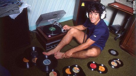Maradona during downtime listening to records at home.