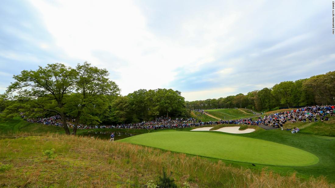 Fans line up near the the eighth green during the second round.