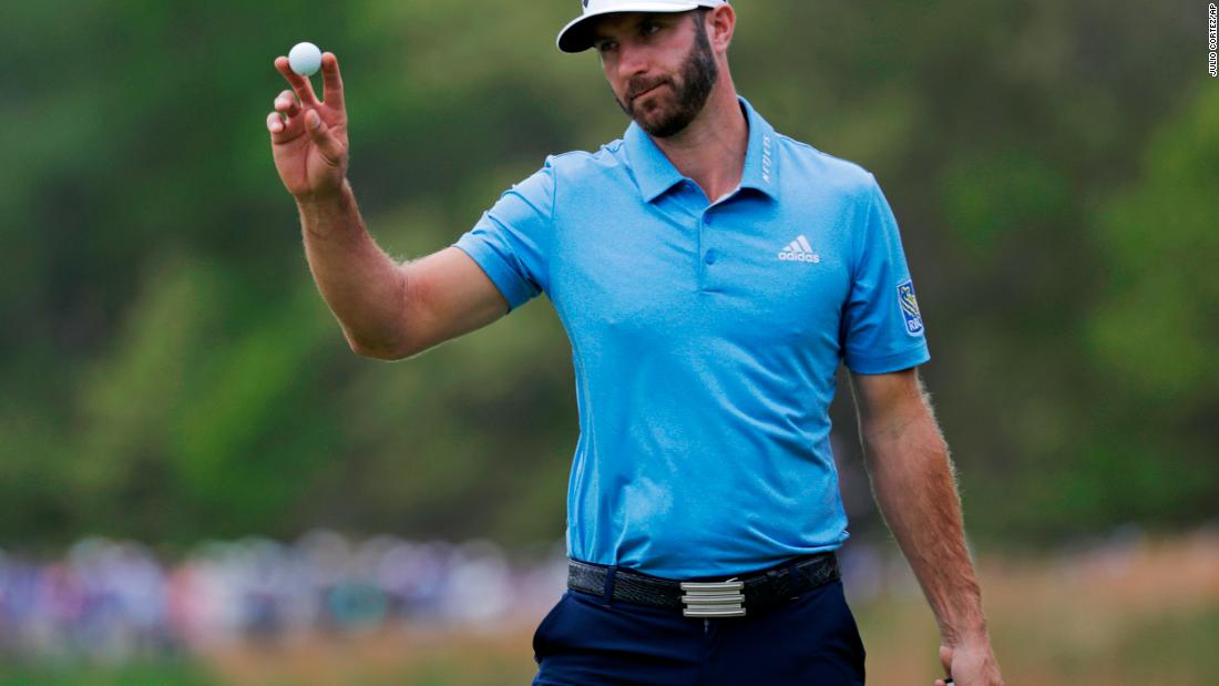 World No.1 Dustin Johnson reacts after putting on the seventh green.