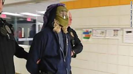 A teacher portraying an active shooter at a school drill wore a scarf typically worn by men in Arab countries.