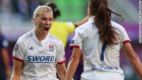 Ada Hegerberg celebrates with teammate Amel Majri.