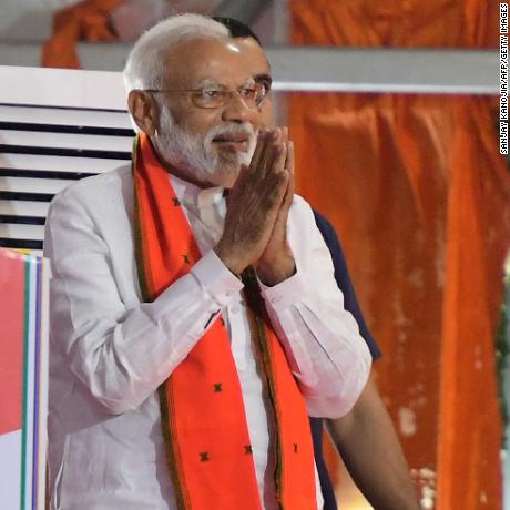 Indian Prime Minister Narendra Modi gestures to supporters as he arrives to a rally ahead of Phase VI of India&#39;s general election in Allahabad on May 9, 2019. (Photo by SANJAY KANOJIA / AFP)        (Photo credit should read SANJAY KANOJIA/AFP/Getty Images)