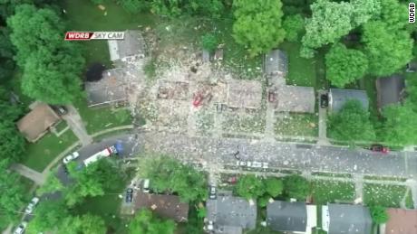 An overhead image shows the remnants of a home strewn across the neighborhood in Jeffersonville, Indiana, on Sunday.