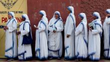 Nuns wait in queue to cast their vote at a polling station during the last phase of Lok Sabha Election or general election on May 19, 2019.