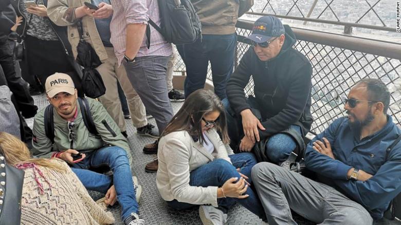 People were stuck on the Eiffel Tower after a person scaled the landmark.