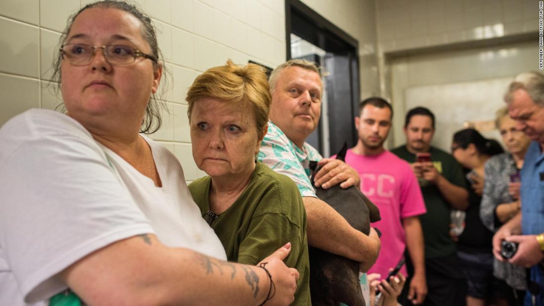 Scared travelers huddle in the back of a gas station for about 15 minutes as doors shook and heavy winds and rain rattled the small building on Monday, May 20. 